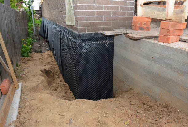 Happy homeowners after waterproofing job in Oakman